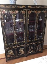 A Two-Piece Asian Black Lacquered Stone Inlayed China Cabinet/Breakfront. Four doors, six drawers and three shelves. Height 72 x Width 60 x Depth 19 inches. In excellent condition.