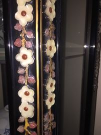 A corner six-sided curio Asian Stone and Mother of Pearl inlay black lacquered display cabinet. Height 75 x Diameter 24 inches. In excellent condition.