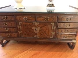 Asian Two-Sided Wood Coffee Table with Brass Hardware, Drawers and Storage on both sides. Width: 42". Height: 18.5". Depth: 22.5". In very good condition.