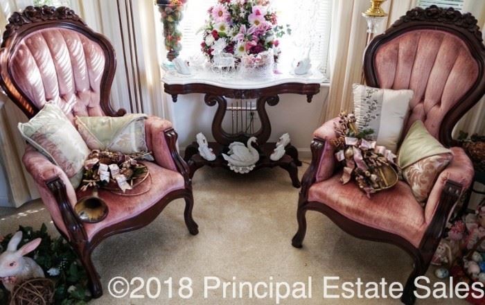 Dual Victorian style arm chairs on either side of the harp shaped marble top table.