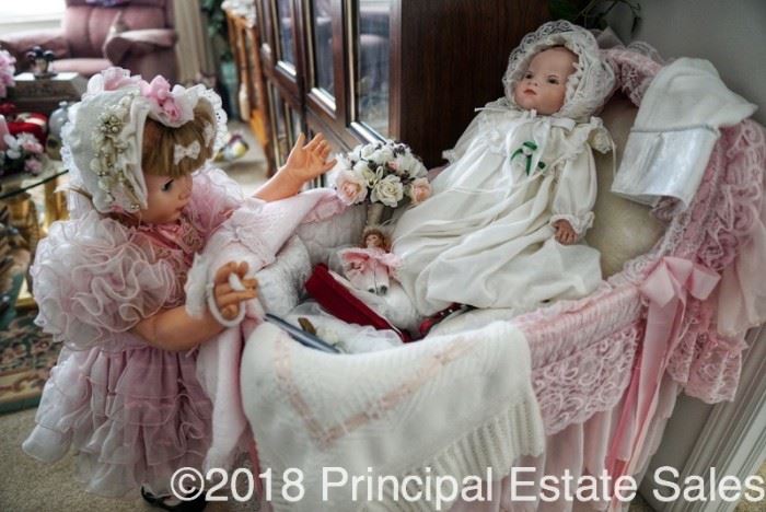 Look at this one doll, looking after this other doll.  Such a precious arrangement.  And that bassinet! 