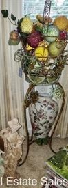 Iron plant stand with bedazzled fruit and vase