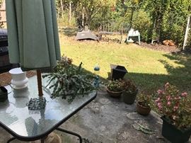 Metal double rocker, Outdoor Table, Umbrella, Plants, Wheel Barrow