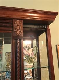 Curio Cabinet slides both directions.  Lighted. 