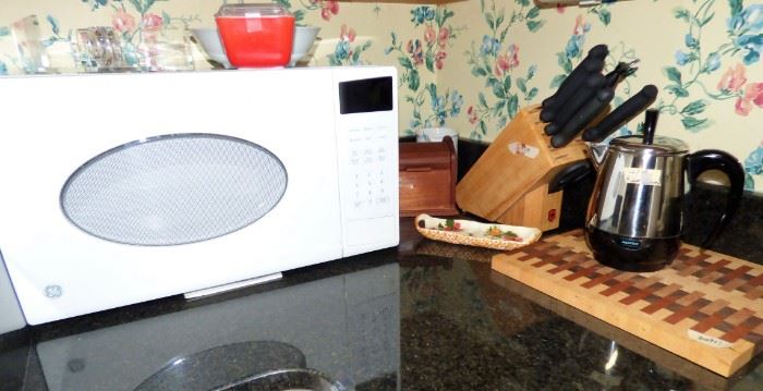 GE microwave, Farberware 4 cup perculator, Knife block with Solingen knife set, hand made wooden cutting board, Pyrex red fridge dish