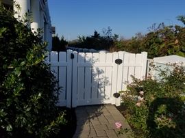 Vinyl gates and small amount of fencing