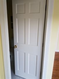 Solid wood 6-panel interior doors throughout