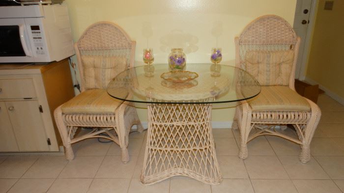 WICKER KITCHEN SET. WICKER PEDESTAL WITH TWO WICKER ARCHED BACK CHAIRS.