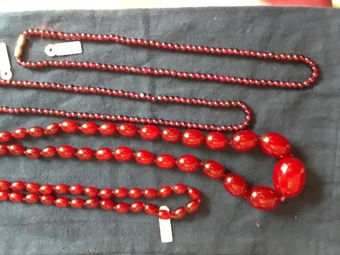 Two strands of garnet beads, long strand of rootbeer amber reduced 50%