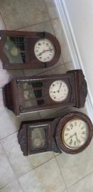 Several wall clocks