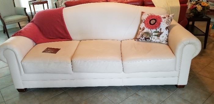Pristine cream colored leather sofa