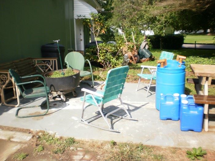 Iron and wood glider.  Vintage green metal chairs.  Webbed aluminum chair and rocker.  X-large cast iron planter on wheeled base.