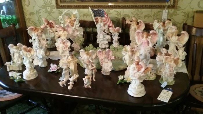 Collection of Seraphim angels, including The Pond and four of the monthly angels with pedestals and porcelain flowers.