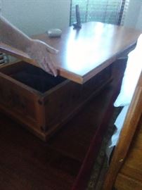 I love these coffee table storage pieces that can be opened up to use as a table....