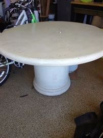 Resin table that looks like cement. VERY heavy. You must bring help that can move items. Please dont send your 80 year old daddy to pick up and expect us or other clients to help. Sorry...LOL...Can you tell this has happened before!