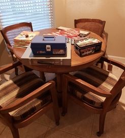 round game table with 4 arm chairs