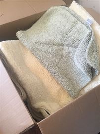Boxes of throw rugs/ bath mats etc.