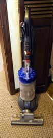 Dyson DC 65 Upright Vacuum With Manual, Assorted Cleaning Supplies, Out Door Light Bulbs, Assorted Hardware, Extension Cords And More