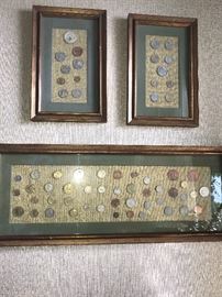 Mexican and other foreign coins displayed in frames