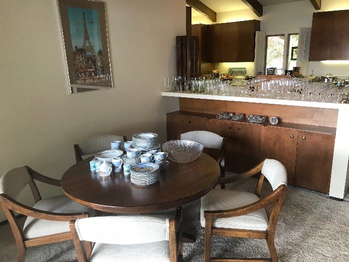 Game table with chairs, Set of dishes.  Glassware on counter