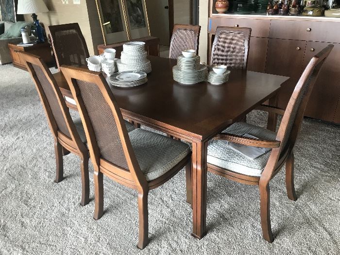 Mid-century or Danish Modern dining table with 2 more leaves and the six chairs shown.  No manufacturers' information found.