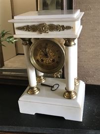 White (French?) Portico clock. Was running when I tried it.  Strikes hours on a bell. Writing on back states it is from "Grandpa Sherwood's Home".  Ca. 1890.