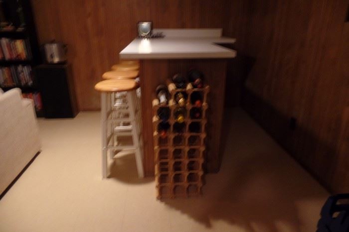 Bar stools and wood wine rack.