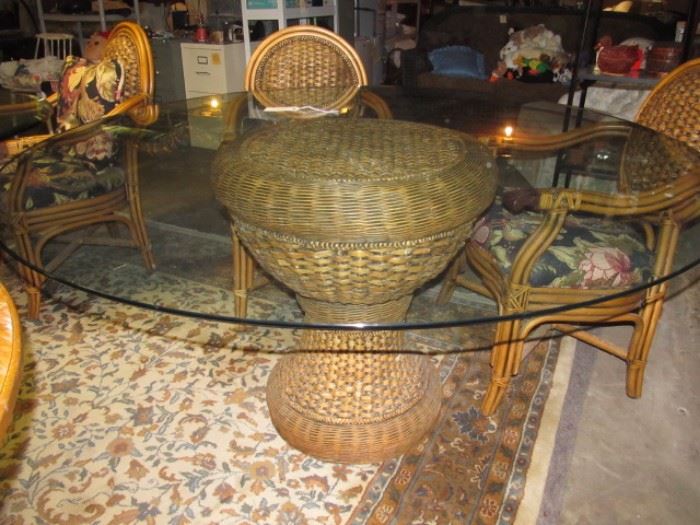 Round rattan and glass table