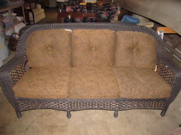 One of 2 matching wicker sofas