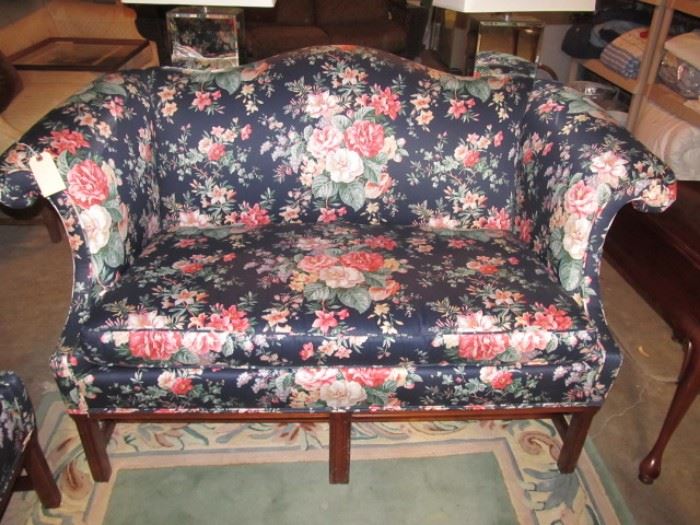 One of a pair of Chintz loveseats-slipcovers available