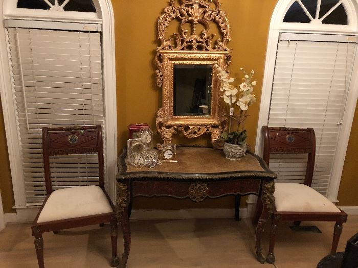 French Writing Desk with Velvet Top. Wood side chairs with face medallion.  Gilt Mirror.  Seth Thomas, Waterford, and Skagen Clocks