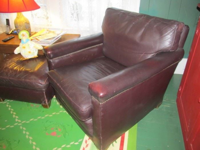 Pair of leather chairs and ottoman