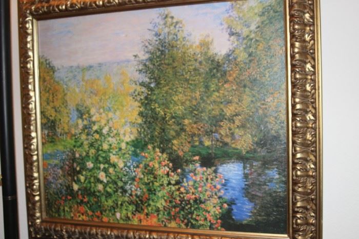 Oil painting of roses and trees around a lake.