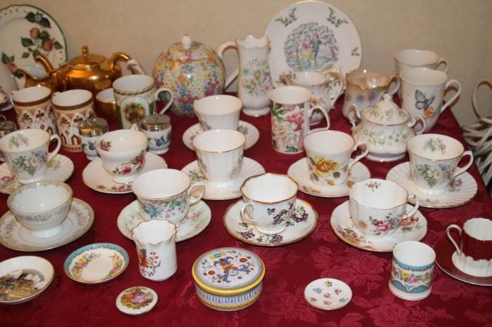 Large selection of bone china tea cups, tea pots, creamers, vases and trinket dishes.