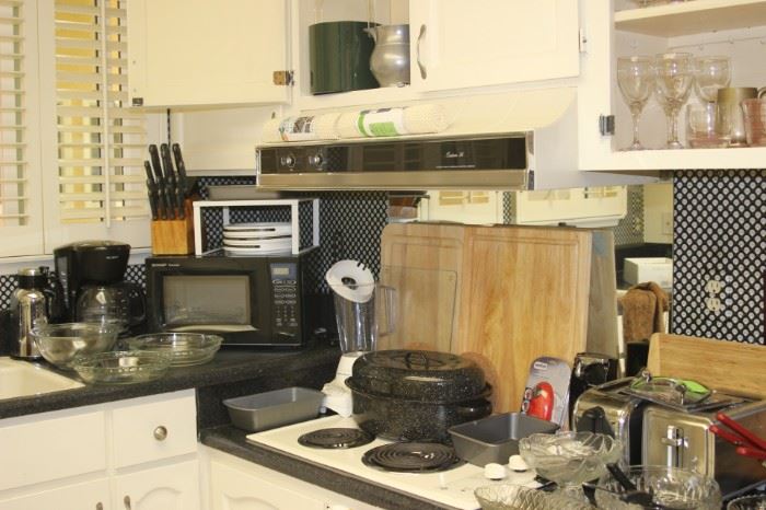 Kitchen items, micro wave, toaster, Pyrex, coffee maker, roasting pans, stemware.