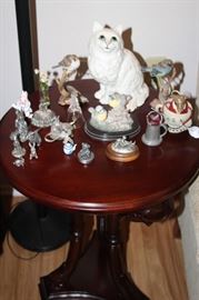 Pedestal table, pewter miniatures and other ceramic figures.