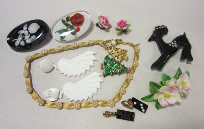 Costume jewlery: lucite pins, white plastic earrings, black plastic deer pin with rhinestones,  Christmas tree pins and more