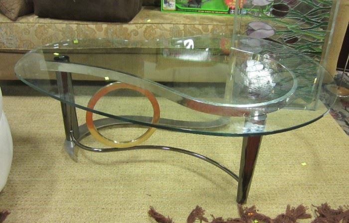 Contemporary glass top coffee table on chrome base.  