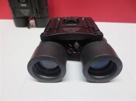 Lot of 2 Tasco 10x25 binoculars..