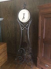 Howard Miller 615004 Vercelli Grandfather clock.  Iron scrollwork with cast stone.  