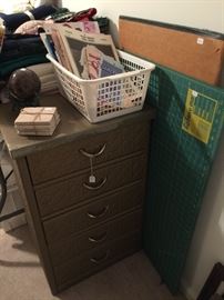 Sewing books, storage container, supplies.