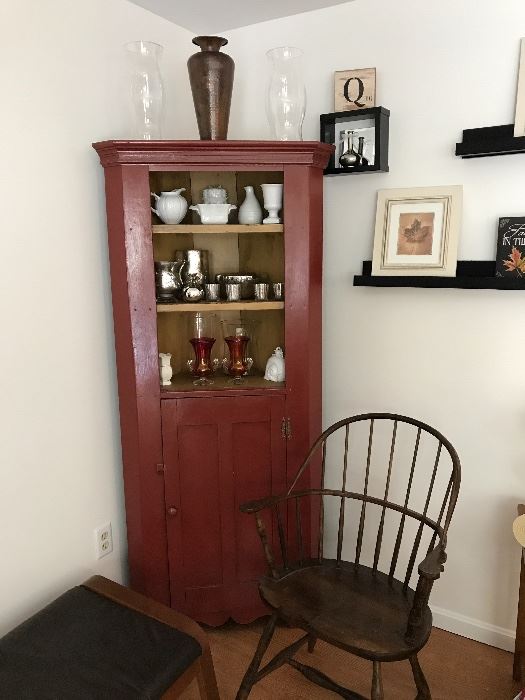 Corner cabinet painted red, Windsor chair, lots of pretty decor