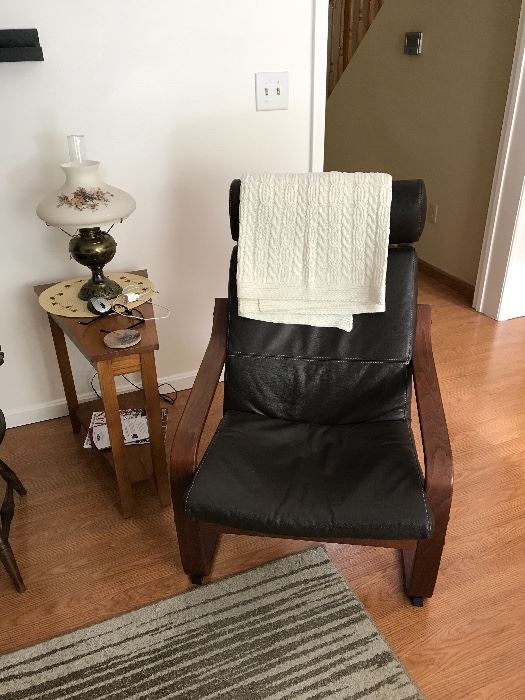 Ikea chair with ottoman, side table, antique lamp
