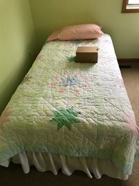 pair of twin beds, bedding sells as well