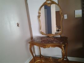 French table and mirror(needs new paint and new marble top). $ 250