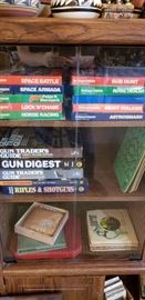 vintage video games, lots of gun books and magazines, however, there are no guns.
