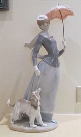 Lady with Umbrella walking a dog