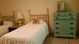 Pair bamboo style twin beds; painted blue chest and vanity.