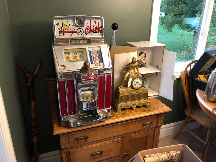 Early 1800’s French made clock.. and a 1950’s Jennings Chief quarter slot. 