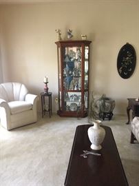 Curio cabinet
 White club chair
Drop leaf coffee table